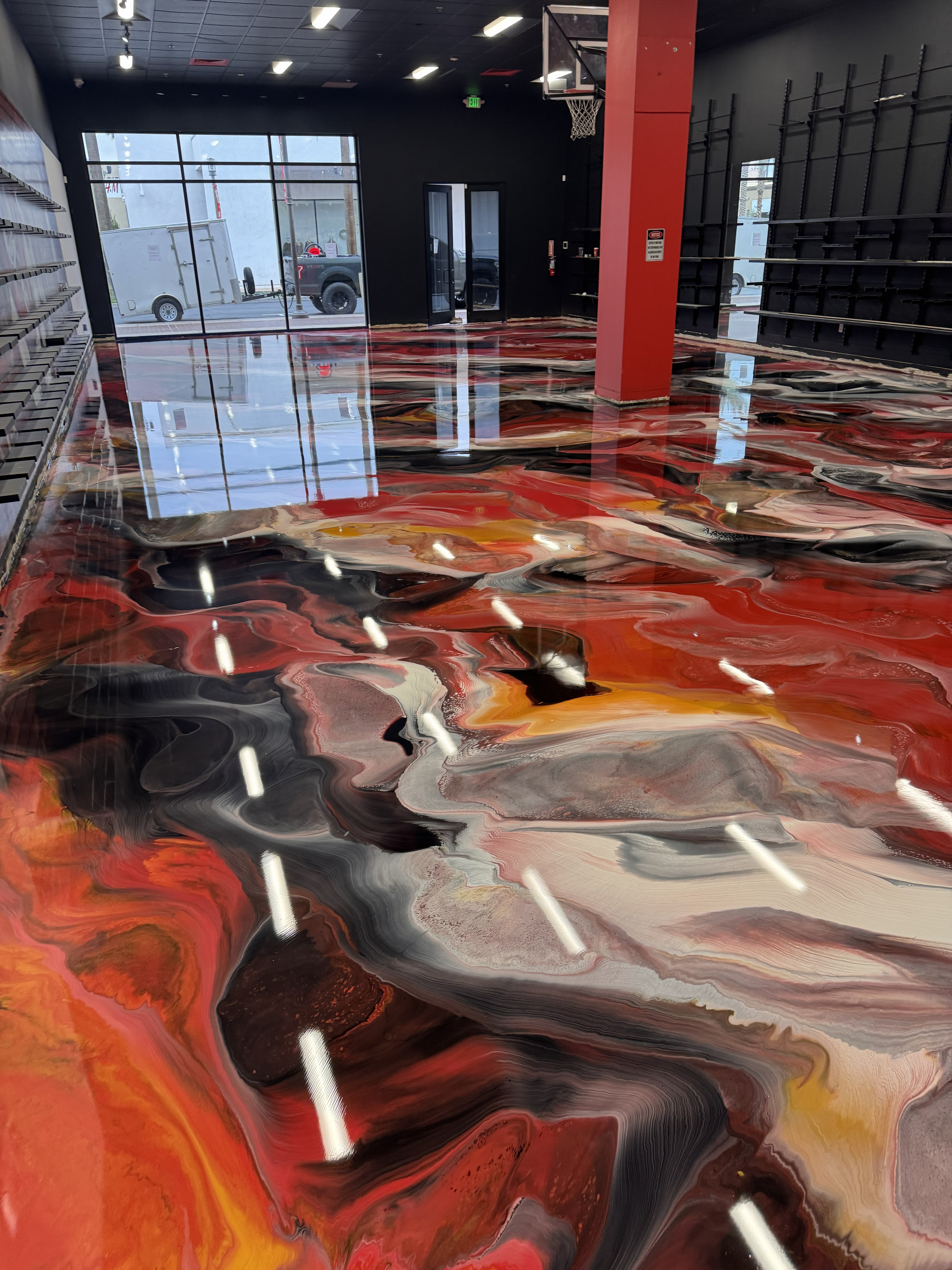 Large commercial space with red metallic epoxy floor