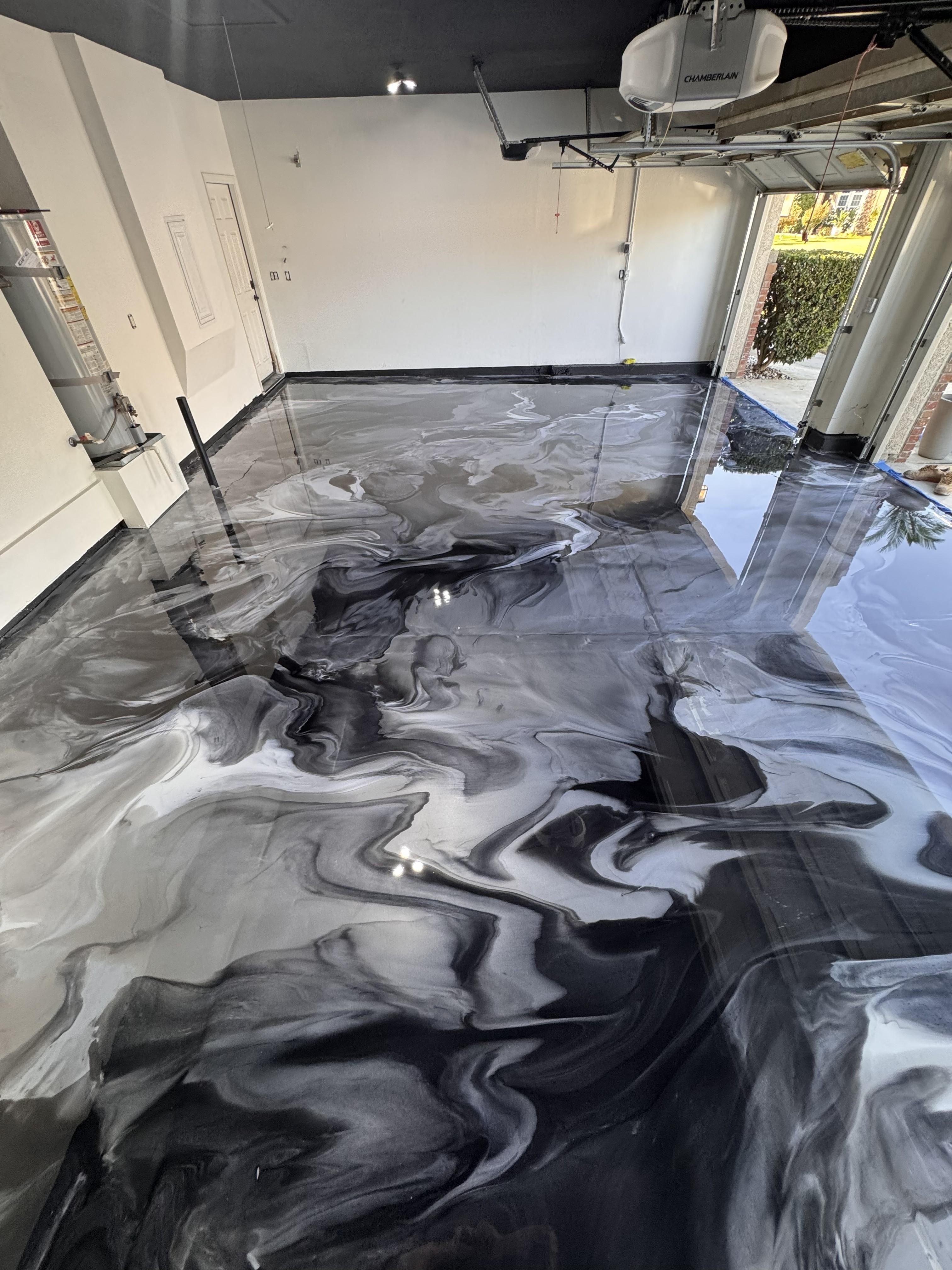 Black and white marble metallic epoxy garage